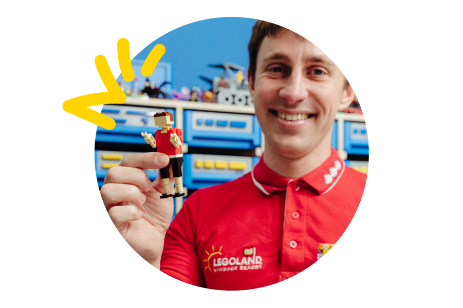 A picture bubble of a LEGOLAND employee holding up a small build of himself