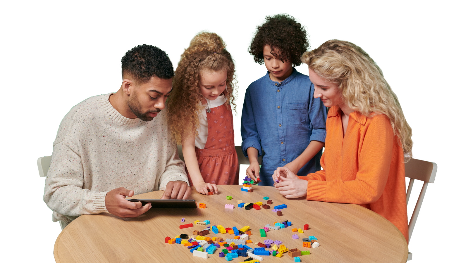 A family play with LEGO bricks together 