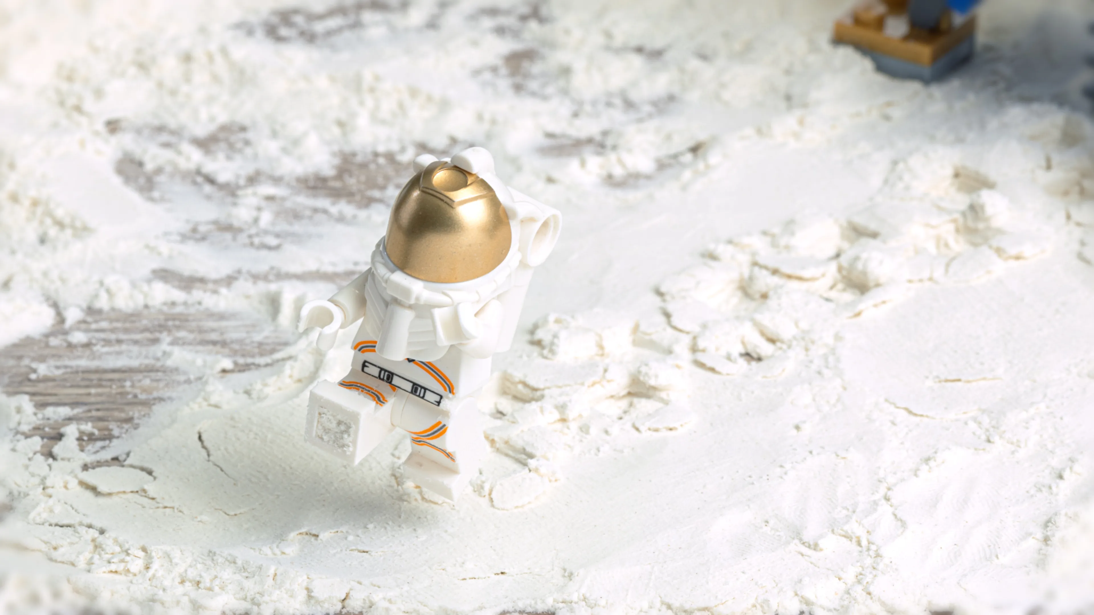 Step a minifigure onto the flour