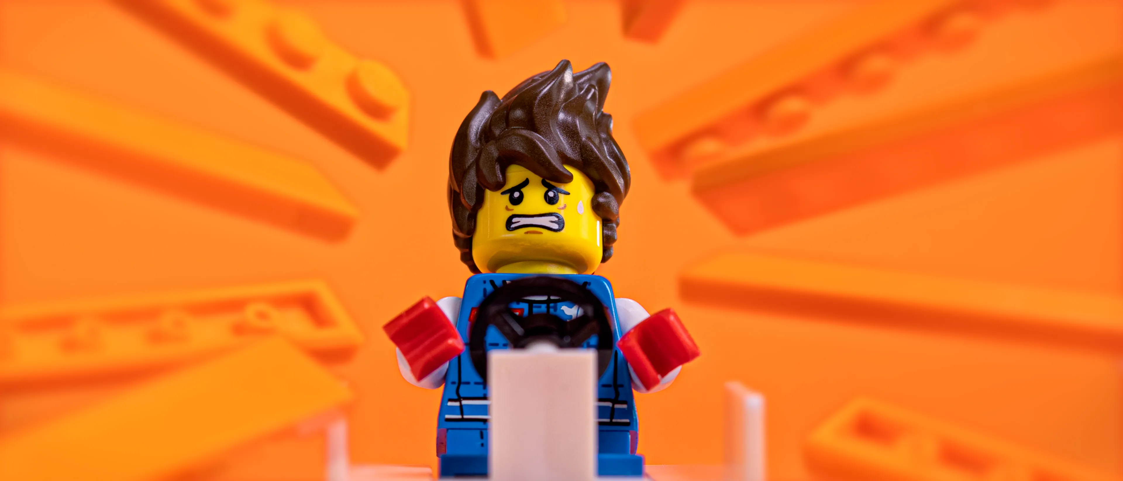 A minifig against an orange background