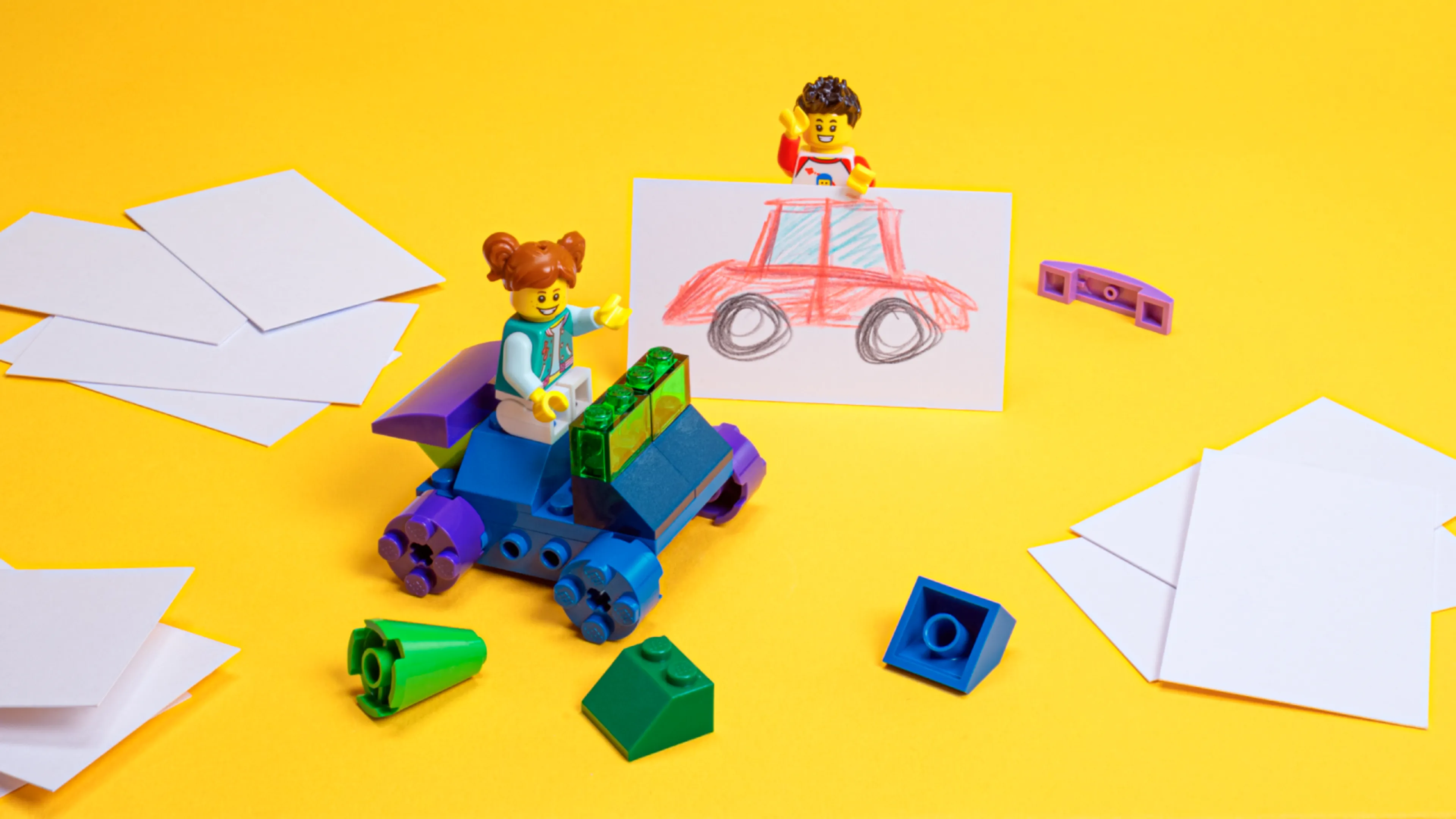 Minifigures with a car build based on a car drawing