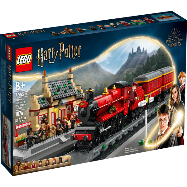 Un Train Lego Est Sur Les Rails Avec Un Petit Bâtiment En Arrière
